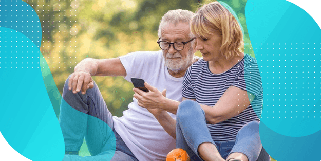 Couple looking at a smartphone together, researching why sponsors are choosing a bring-your-own-device (BYOD) study model.