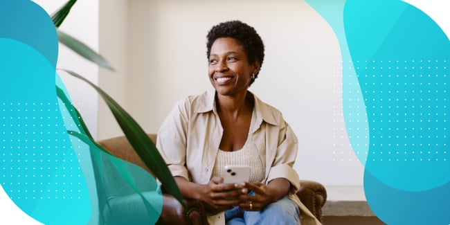 smiling black woman using phone for ePRO clinical trials