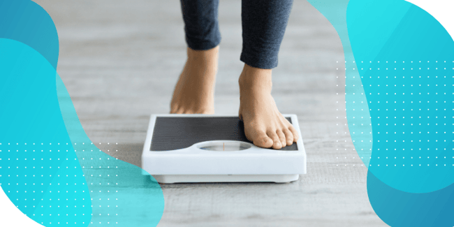 A person stepping onto a scale, emphasizing the importance of monitoring progress and capturing high-quality data to enhance patient experience in obesity drug development with GLP-1 agonists.