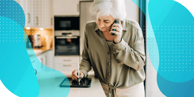 Woman on a phone call, looking at her tablet, researching the benefits of eConsent in clinical trials.