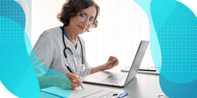 Female doctor taking notes on a computer, representing the simplified clinical trial workflows enabled by Signant SmartSignals® Unified Platform.