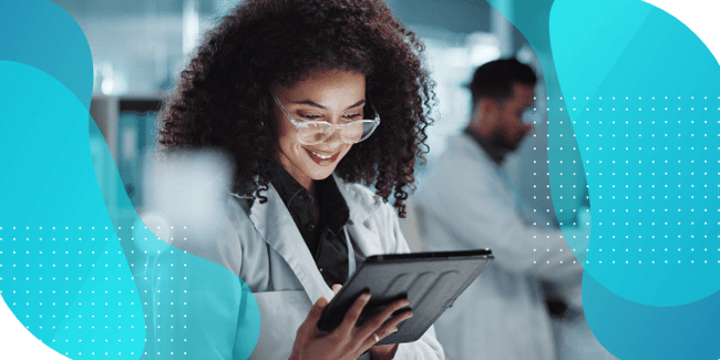  A doctor in a clinical setting examines a tablet, symbolizing the evaluation of patient-reported outcomes (PROs) in oncology.