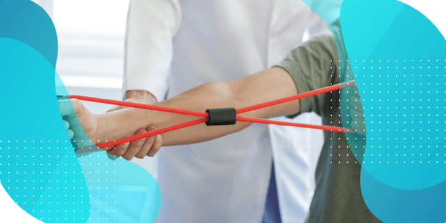  A healthcare professional assists a patient performing arm exercises using a red resistance band.
